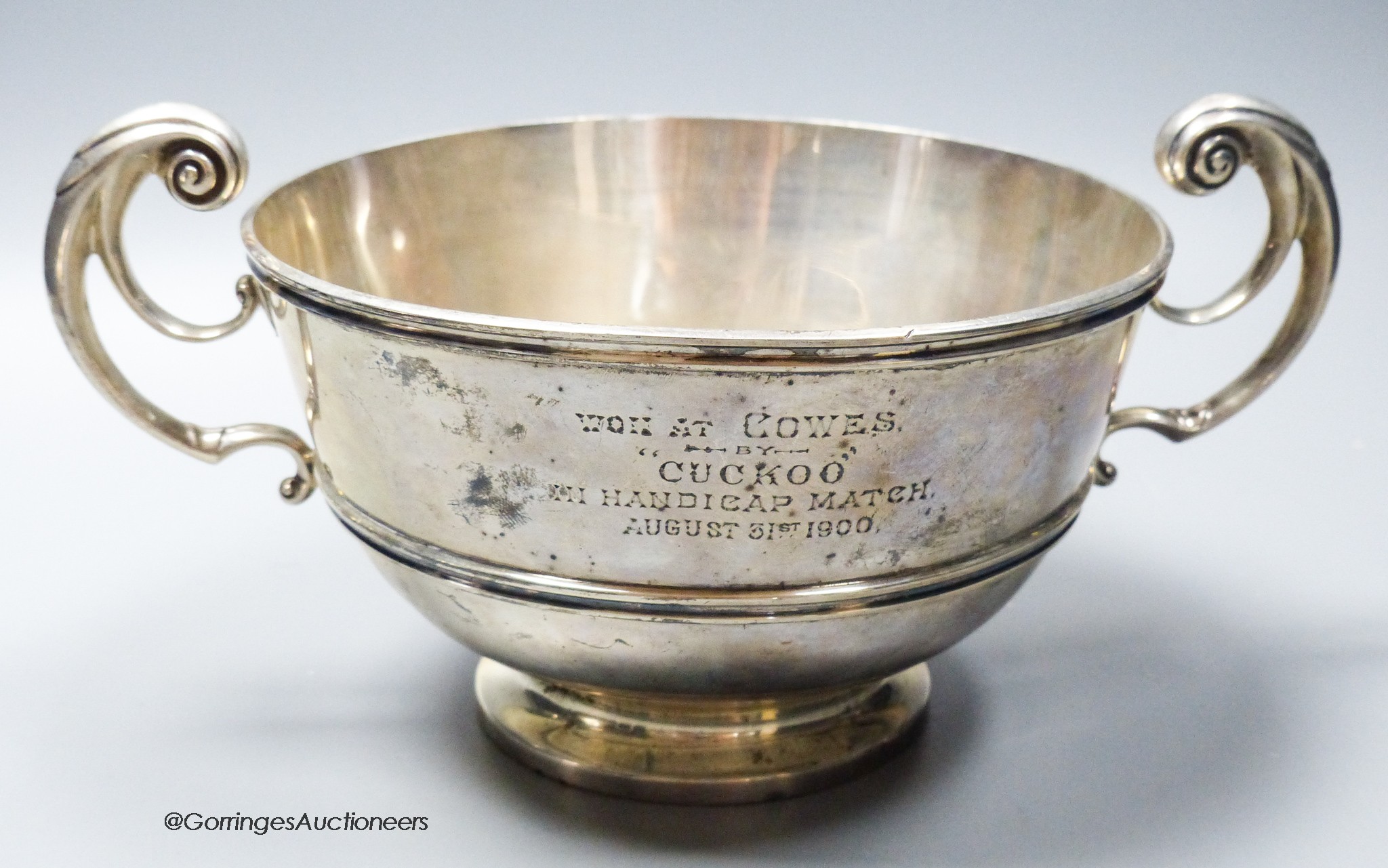 A late Victorian silver two handled presentation bowl, with Cowes, Isle of Wight related inscription, Charles Stuart Harris, London, 1898, diameter 18cm, 21.5oz.